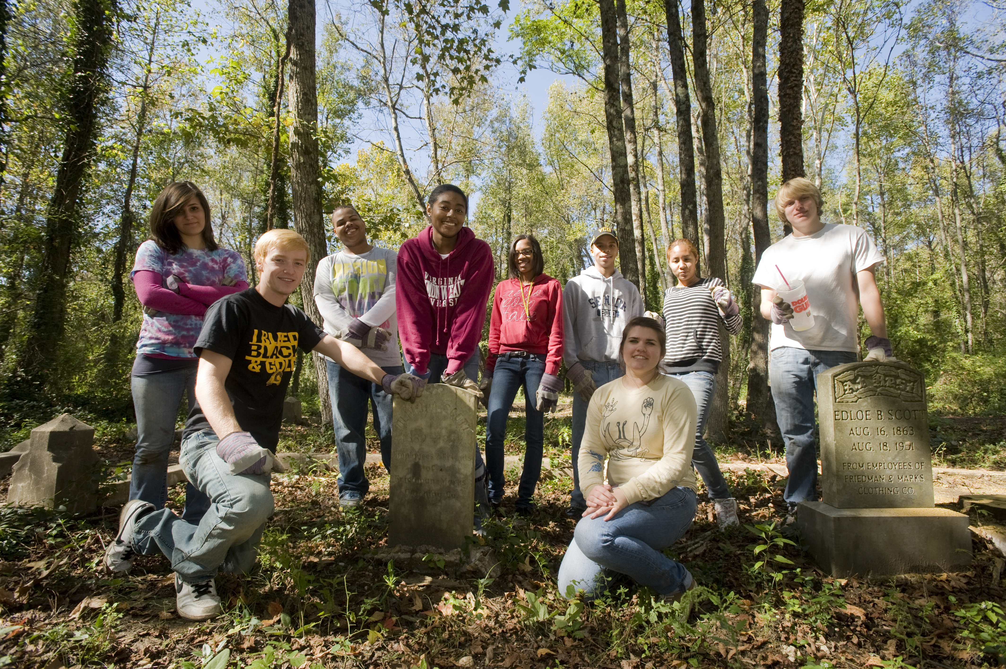 Students pose for a photograph as they clean up an African-American cemetery in Richmond's East End.